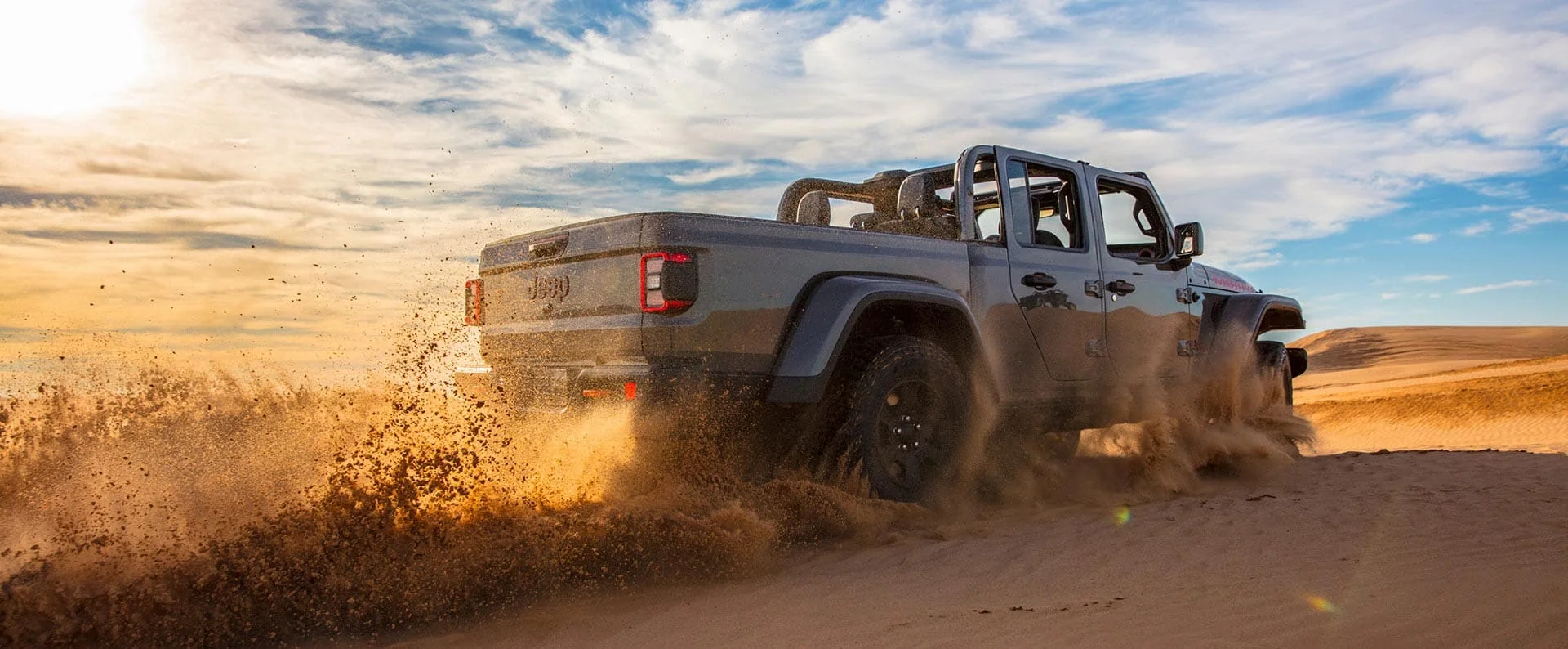 2026 Jeep Gladiator exterior hero image in a clean outdoor setting.